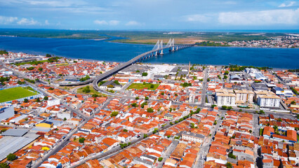 City of Aracaju, showing buildings and the bridge that gives access to the municipality of Barra dos Coqueiros..  - obrazy, fototapety, plakaty