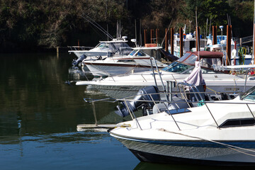 Fototapeta premium Motor Boats In Dock Slips At Marina