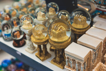 View of traditional tourist souvenirs and gifts from Athens, Attica, Greece with fridge magnets with text 