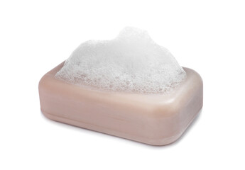 Soap bar with fluffy foam on white background