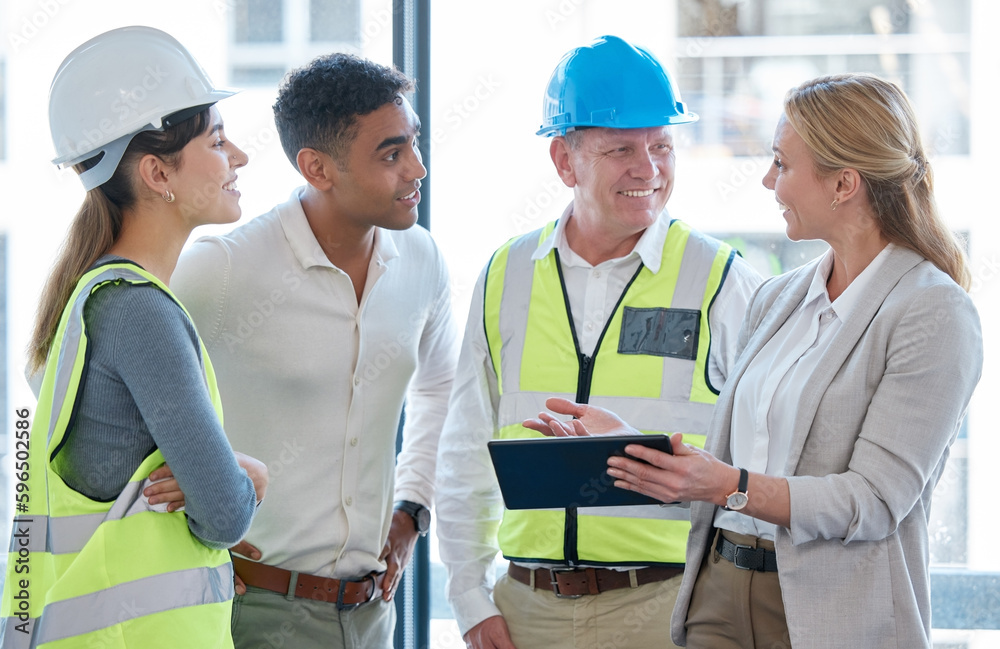 Poster building plans are digital now. cropped shot of four construction workers looking over a tablet whil