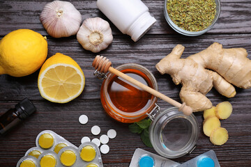 Different cold remedies on wooden table, flat lay. Cough treatment