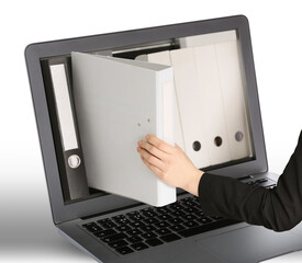Digital archive. Woman taking folder right from laptop screen, closeup