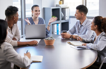 Fototapeta premium Excited to start our new project. Shot of a group of businesspeople having a meeting in a modern office.