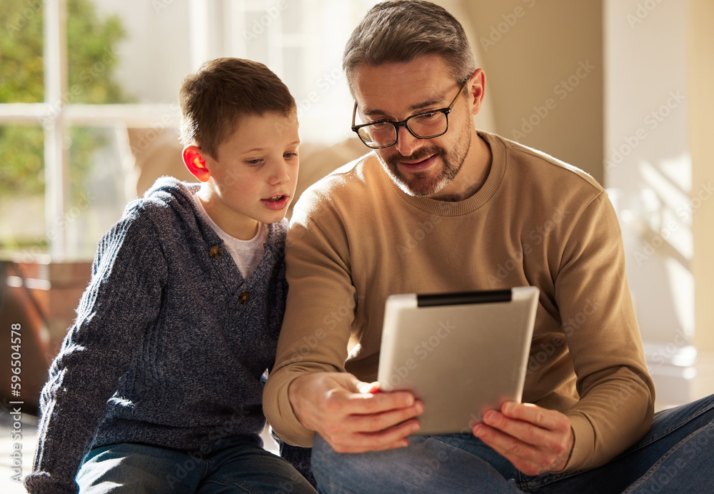 Canvas Prints Thats so cool. Shot of a father and son using a digital tablet together at home.