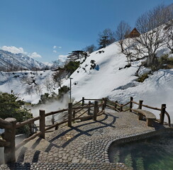 Russia. Kuril Islands. View of the baths of the thermal spring (Boiling river) near the volcano...