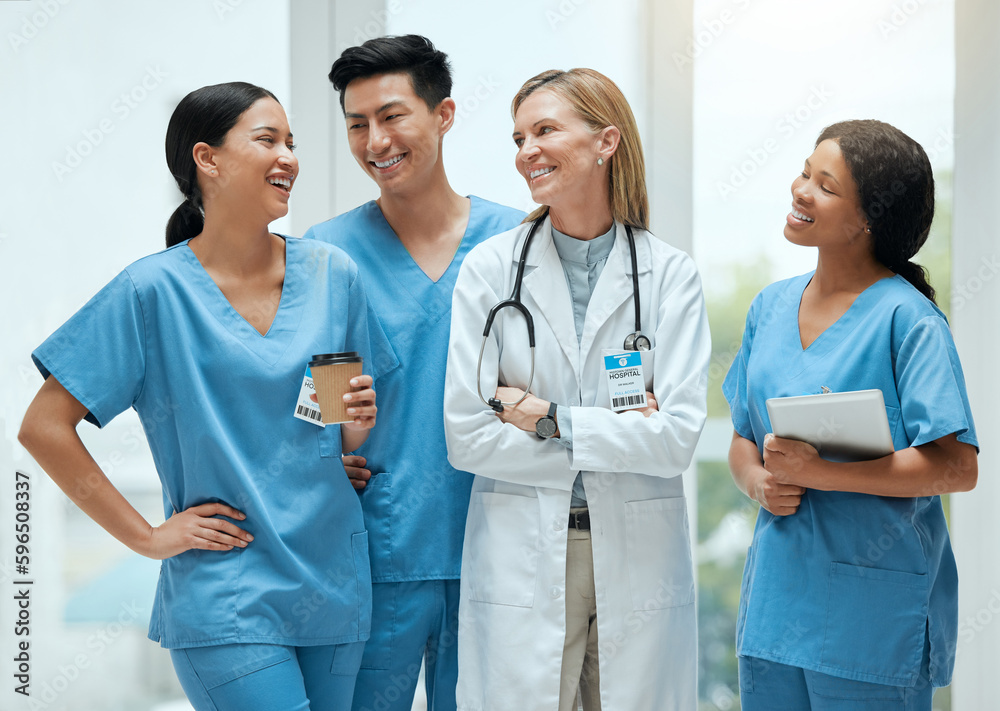 Poster start the day with a chuckle. shot of a group of medical practitioners having a discussion in a hosp