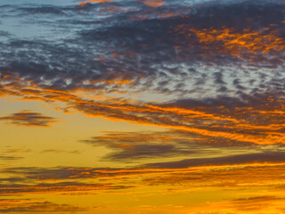 Fototapeta na wymiar Sunrise cloudscape in shades of purple and orange