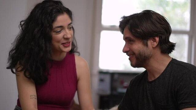 A Loving Moment: Happy Couple Bonding with their Golden Retriever Pet at Home while laughing and smiling