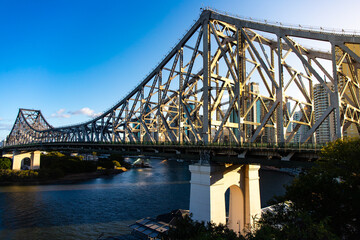 panorama of brisbane cbd on sunset; skyscrapers and famous story bridge in downtown of brisbane city in queensland, australia - obrazy, fototapety, plakaty