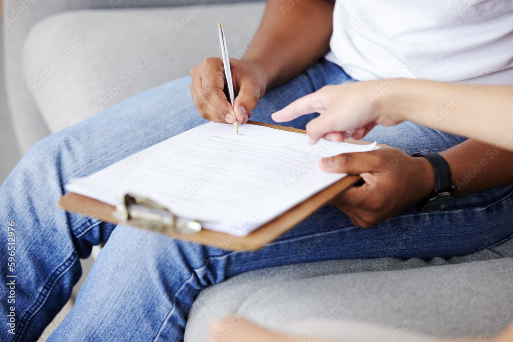 Poster where do i sign. cropped shot of an unrecognisable rental agent sitting with her client and showing 