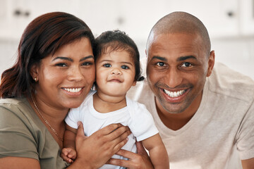 A blessing in human form. Shot of a young family spending time together at home.