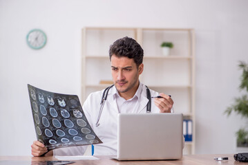 Young male doctor radiologist working in the clinic