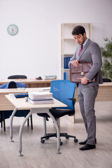 Young male employee working in the office