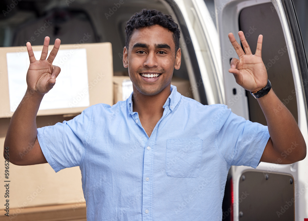 Poster enjoying his day of successful deliveries. portrait of a young delivery man gesturing an okay sign w