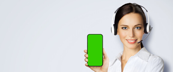 Customer support phone operator in headset hold show smartphone cell phone mobile green chroma key...
