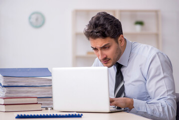 Young male employee working in the office