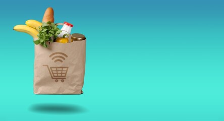 Paper grocery bag with groceries, delivering concept