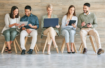 Business could not exist without technology. Full length shot of a diverse group of businesspeople...