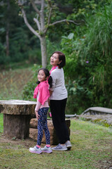 Fototapeta premium A girl and a middle-aged woman turning around and smiling.