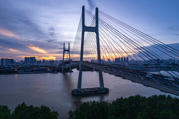 Obraz premium Sunset at Phu My bridge, Saigon riverside, Ho Chi Minh city, Vietnam. April 2023