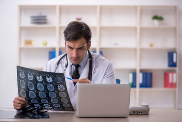 Young male doctor radiologist working in the clinic