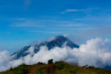 photo of a hill covered in clouds on Mount Merbabu, Indonesia