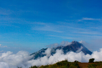 photo of a hill covered in clouds on Mount Merbabu, Indonesia