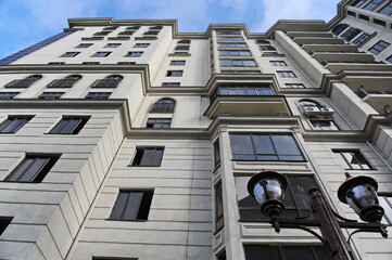 Almaty, Kazakhstan - 11.23.2015 : A metal lantern stands at a multi-storey residential complex.