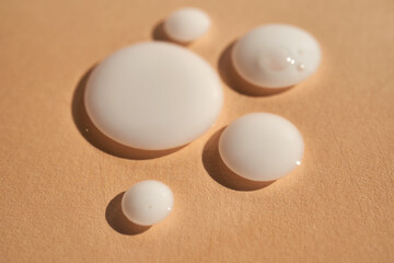 Fototapeta na wymiar Drops of white milk consistency.