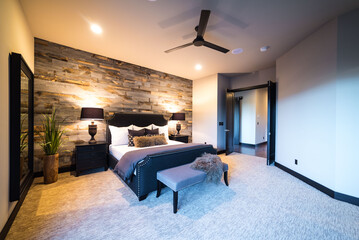 Beautiful Master Bedroom Featuring Wood Wall
