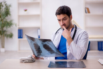 Young male doctor radiologist working in the clinic