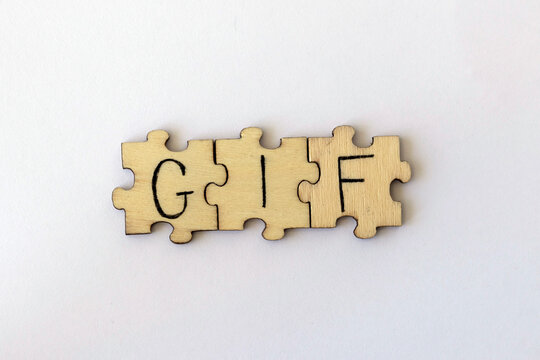 The acronym GIF, which stands for Graphics Interchange Format. The letters written on the puzzles.