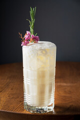 cocktail with flowers on the wooden background