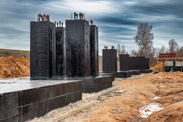 Monolithic reinforced concrete foundation waterproofed with bituminous mastic. Rostverk at the...
