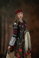 Beautiful woman in ethnic vyshyvanka embroidered blouse