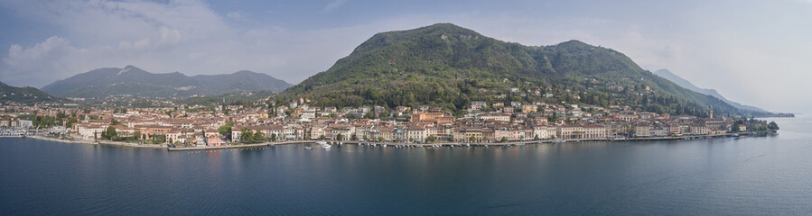 Fototapeta na wymiar Tourist site on Lake Garda. Aerial view of the town on Lake Garda. Panoramic view of the historic part of Salò on Lake Garda Italy.