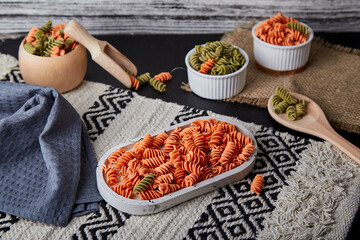 Gluten free and carrot fusilli pasta with whole grain wheats. Organic healthy food for lactose...