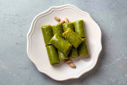 Pistachio baklava. Traditional Middle Eastern Flavors. The local name of Baklava is Fıstıklı Baklava or fıstıklı dolama. Turkish style pistachio baklava presentation and service