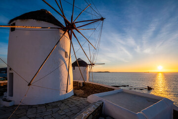 Traditional greek windmills on Mykonos island at sunrise, Cyclades, Greece