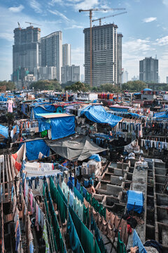Dhobi Ghat is an open air laundromat lavoir in Mumbai, India with laundry drying on ropes