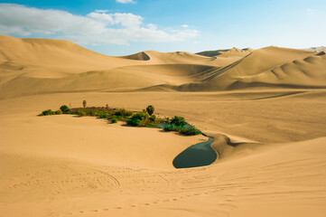 The Huacachina Oasis, in the desert sand dunes near the city of Ica, Peru