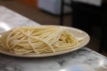 Flour noodles served on a plate