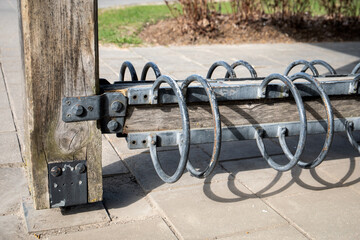 An empty bike shed in the park. Warm sunny day