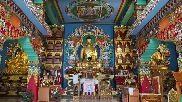 Tourists worship the Buddha Statue inside of the Buddhasikkhalay Monastery at Bodhgaya in Bihar northeast India.