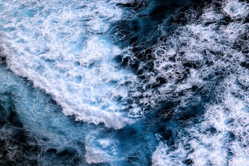 Fototapeta na wymiar wave in the ocean abstract background, blue sea texture motion