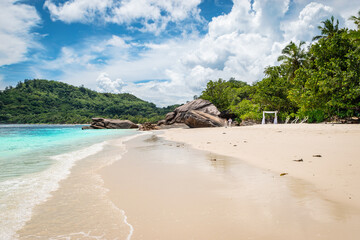 Beautiful tropical white sand beach in the Seychelles. Famous beach for weddings.