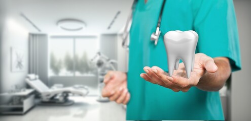 Dental clinic concept. Dentist hold a healthy tooth model