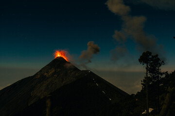 Volcano Fuego erupting at night from view of Volcano Acatenango, Guatemala