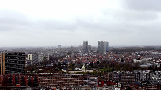 A slow zooming out video of Brussels city from a top view. The camera shows the iconic landmarks and buildings of the capital of Belgium in a TV style. A great footage for travel or culture themes.